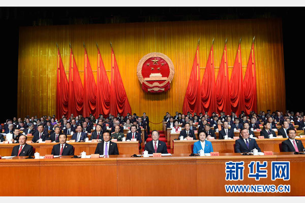 10月1日，慶祝中華人民共和國成立66周年暨新疆維吾爾自治區成立60周年大會在新疆人民會堂隆重舉行。 新華社記者 饒愛民 攝