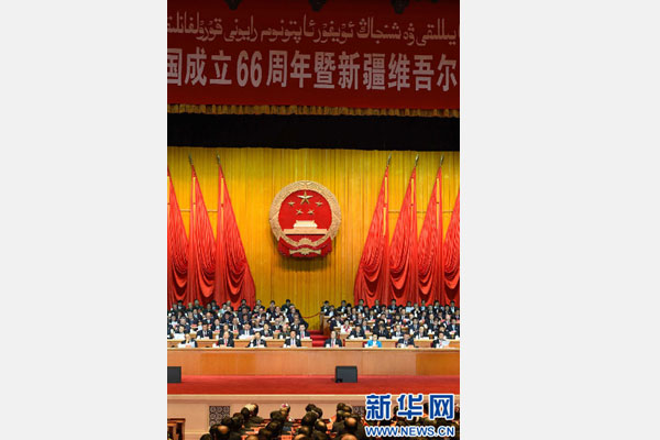 10月1日，慶祝中華人民共和國成立66周年暨新疆維吾爾自治區成立60周年大會在新疆人民會堂隆重舉行。 新華社記者 高潔 攝 