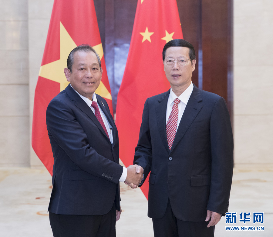  9月11日，中共中央政治局常委、國務院副總理張高麗在廣西南寧會見前來出席第十四屆中國－東盟博覽會和中國－東盟商務與投資峰會的越南常務副總理張和平。新華社記者王曄攝